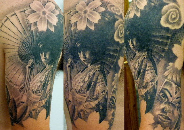 Black and grey japanese oriental arm piece portrait tattoo