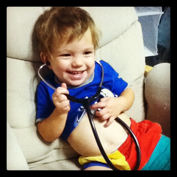 Practicing with daddy's stethoscope!