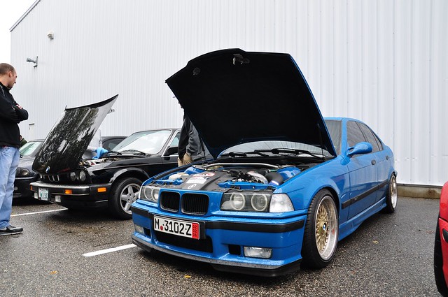  Blue BMW e36 M3 Sedan with a Dinan Supercharger and polished Style 5's