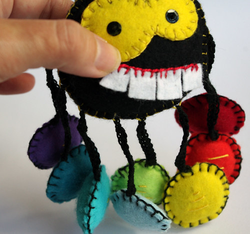 Spider stuffed with rainbow shoes