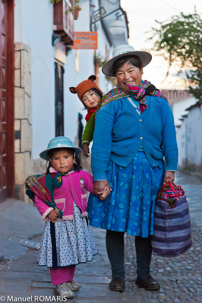 Cuzco, Peru, woman in blue with two children