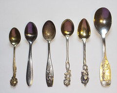 six ornate spoons