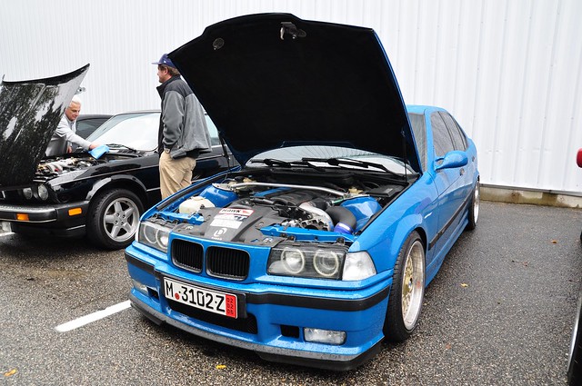  Blue BMW e36 M3 Sedan with a Dinan Supercharger and polished Style 5's