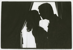 Couple in window - a monochrome