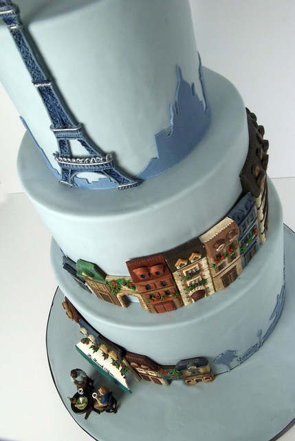 A Parisian Theme wedding cake with the Eiffel Tower and quaint Paris street