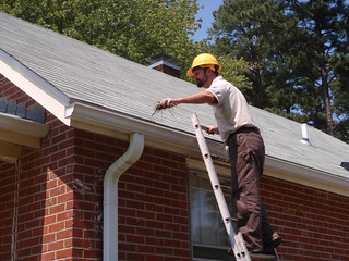 Cyrus Brame cleaning gutters
