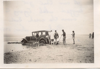 A car is bogged at Port Parham South Australia in 1951