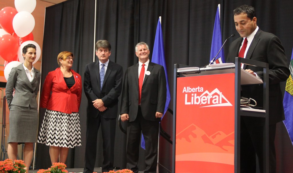 Raj Sherman delivers his leadership victory speech as leadership chair Josipa Petrunic, and candidates Laurie Blakeman, Hugh MacDonald, and Bruce Payne look on (September 2011).