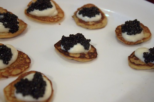 Caviar & white chocolate on a curry blini