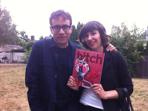 Carrie Brownstein and Fred Armisen holding a copy of Bitch