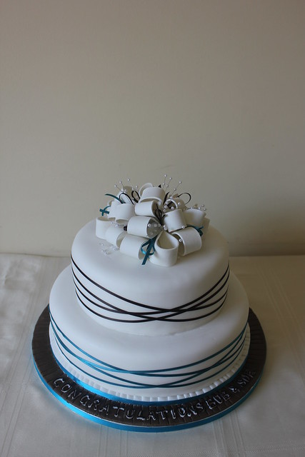 chocolate and teal wrapped ribbon wedding cake