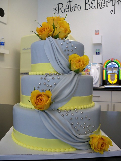 Grey and Yellow draped fondant wedding cake
