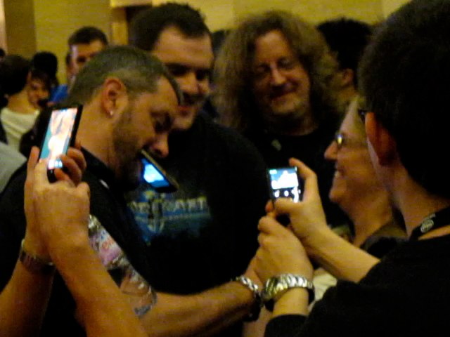 Yup that's Chris Metzen signing the same pair of boobs that Dave Grohl