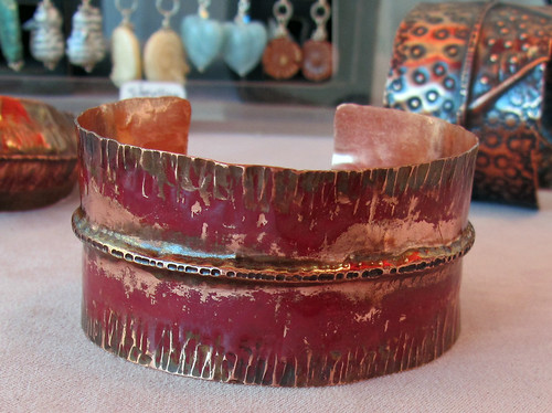 fold formed cuff with red fire scale