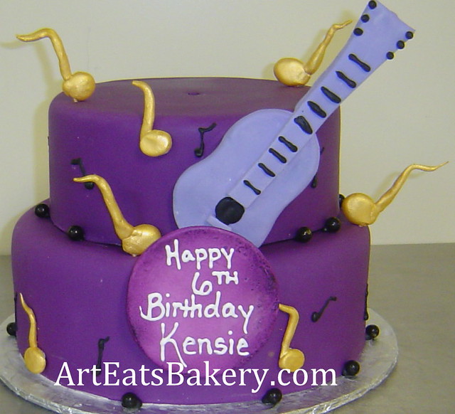 Two tier purple fondant girl 39s Justin Bieber theme birthday cake with guitar