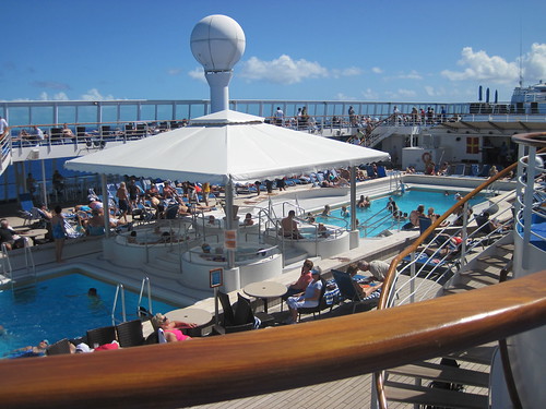 Busy pool deck on a day at sea
