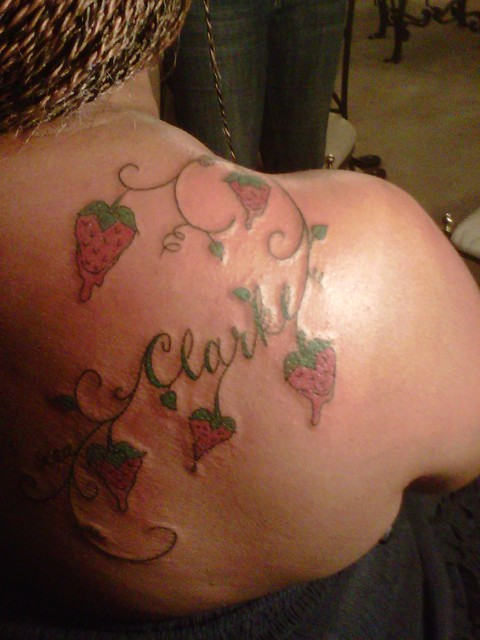 vine of strawberries with name tattoo on back name tattoos on back