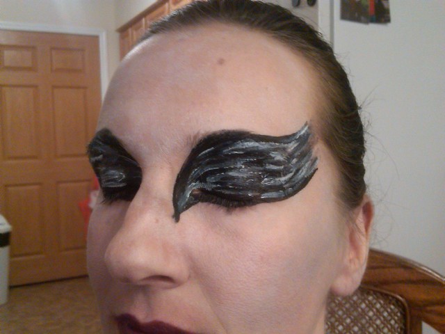 halloween face painting for a Black Swan costume