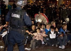 Los Angeles cops attack the Occupy Movement arresting dozens. The federal government has coordinated the busting up of anti-capitalist demonstrations across the country. by Pan-African News Wire File Photos