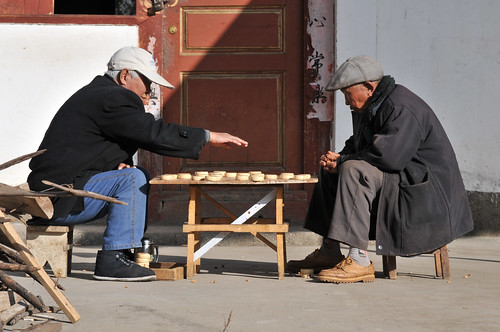 Baisha China - old men playing Chinese chess