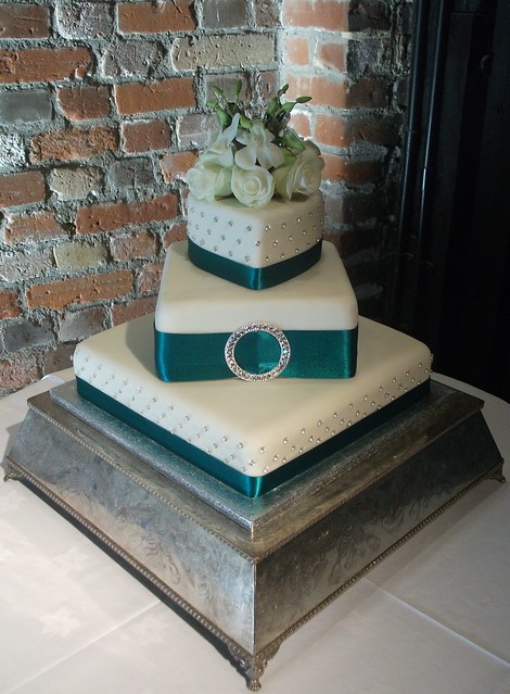 Teal Ivory Diamante Wedding Cake A three tier stacked wedding cake 