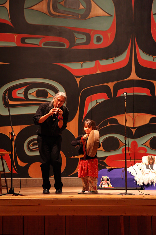 Gene Tagaban and a young audience member perform in Sitka, Alaska