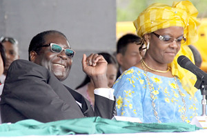Republic of Zimbabwe President Robert Mugabe with First Lady Amai Grace Mugabe at a public gathering inside the country. Zimbabwe has challenged western imperialism over the land redistribution program. by Pan-African News Wire File Photos