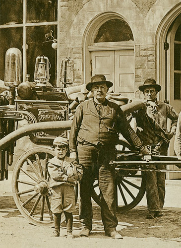 people usa man men history boys sepia kids buildings children hardware clothing andrews workmen indiana machinery firestation waterpump businesses wagons realphoto huntingtoncounty hoosierrecollections