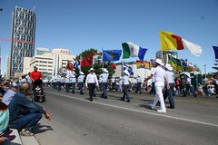 Flags at parade. Bow in background.