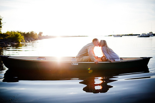 sunset ny love kiss kissing couple bokeh canoe flare henderson engagementphotos sackettsharbor bertpohlphotography
