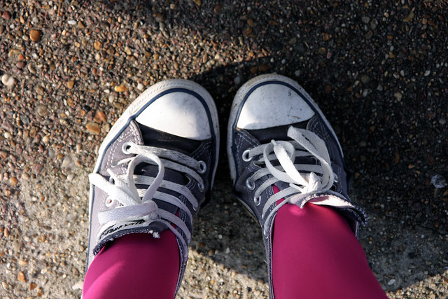 Blue Converse and pink tights