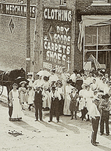 girls horses people woman usa signs man men history dogs boys kids buildings advertising children awning clothing women shoes general crowd indiana streetscene flags celebration transportation shops pedestrians cigars storefronts buggy buggies gaston businesses wagons departmentstores delawarecounty realphoto hoosierrecollections