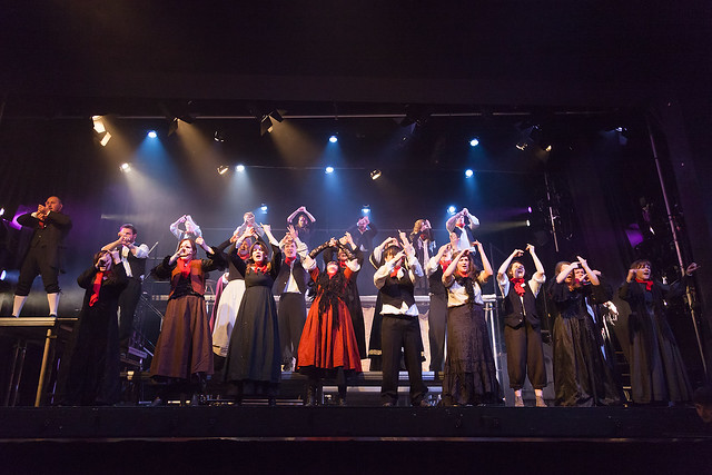 The chorus of Edinburgh Music Theatre's Sweeney Todd integrating BSL into their choreography. Photo credit Alan Potter.