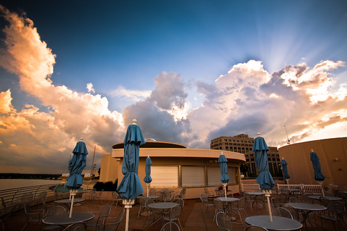 city blue light sunset summer sky urban usa storm rooftop weather june wisconsin architecture publicspace clouds photography restaurant evening photo cafe midwest closed downtown chairs image dusk empty picture stormy franklloydwright patio madison cumulus tables northamerica rays sunrays umbrellas canonef1740mmf4lusm cloudscape sunbeams stormclouds afterhours mononaterrace lakemonona isthmus 2011 canoneos5d danecounty madison365 portalwisconsinorgselected lorenzemlicka lakevistacafe williamtevjuerooftopgarden portalwisconsinorg062911