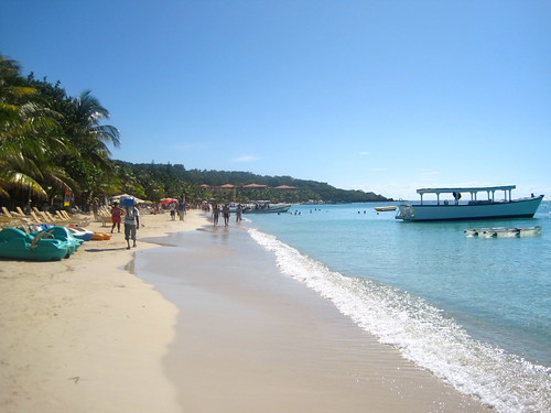 white sanded crystal clear blue water caribbean sea roatan beach, honduras
