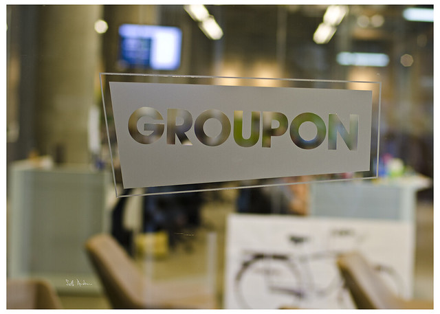 groupon logo on  glass door
