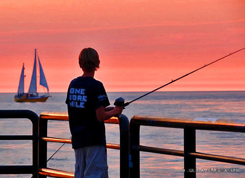 sunset people water fishing michigan lakemichigan charlevoix