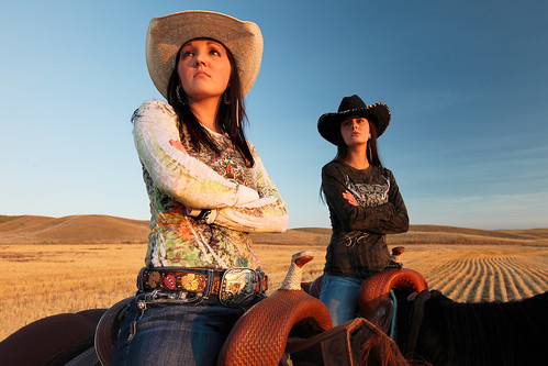 ranch blue girls two portrait sky horses people sunlight nature beautiful field leather horizontal cowboys youth rural hair landscape outdoors countryside clothing women montana sitting mt pair country working young posing lifestyle wear clear attitude riding teen shirts rows havre age western rodeo strong torso strength recreation copyspace agriculture cowgirls tough horseback saddle saddles goldenhour apparel armsfolded lookingaway cowboyhats ranching beltbuckle riders stockphoto westernwear greatplains femininity stockphotography foldedarms travelphotography hillcounty colorimage agritourism competetive hiline toddklassy