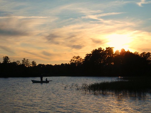 sunset lake boat fishing sweden linneryd