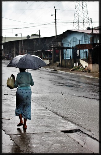 life travel woman rain dark costarica gray streetphotography documentary worldphotographyday lacarpio soles4souls shuttersisters volunteertravel travel4souls