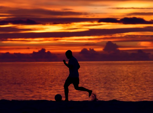 sunset sky fish male beach sports football soccer tropical maldives atoll teamsports sportsrecreation madivaru