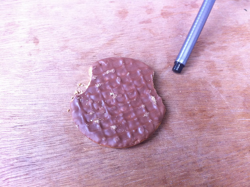 Prototype chocolate biscuit with built in hand grips to enable dunking whilst preventing chocolate sticking to the fingers