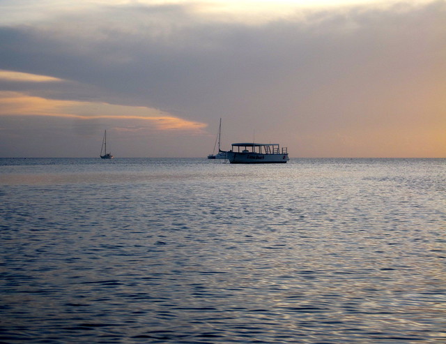 lonely boat on the caribbean sea of honduras