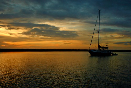 sunset water sailboat canon golden boat still stilness opticspro dxolabs mdggraphix