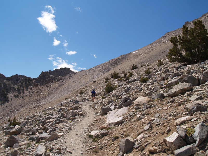 Hiking the final scree and talus field approaching Kearsarge Pass