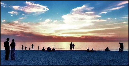 sunset people beach gulfofmexico water clouds sand gulf florida vibrant horizon silhouettes shore naples seashore iphone colorphotoaward