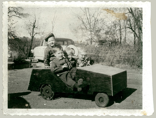 Four children in a push car