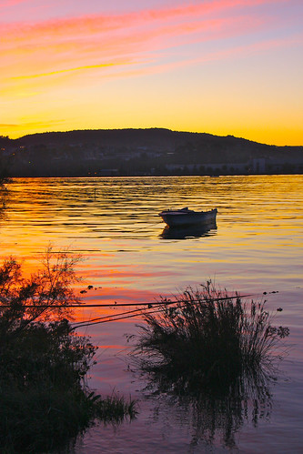 sunset reflection water boat marisma colindres