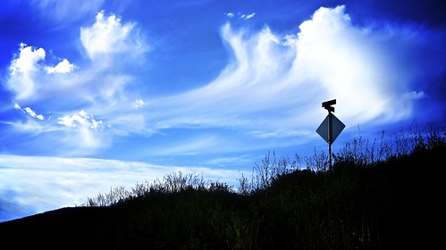 road blue sky cloud silhouette sign cross hill columbia british section revelstoke nex