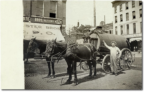 horses people usa signs man men history buildings walking advertising awning hardware workmen indiana streetscene machinery anderson shops pedestrians cigars storefronts theaters madisoncounty businesses wagons theatres realphoto hoosierrecollections